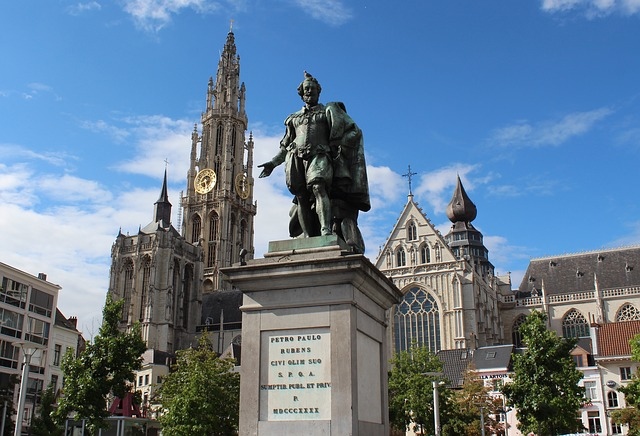 A cathedral and historic statue in a port city of Antwerp near Brussels